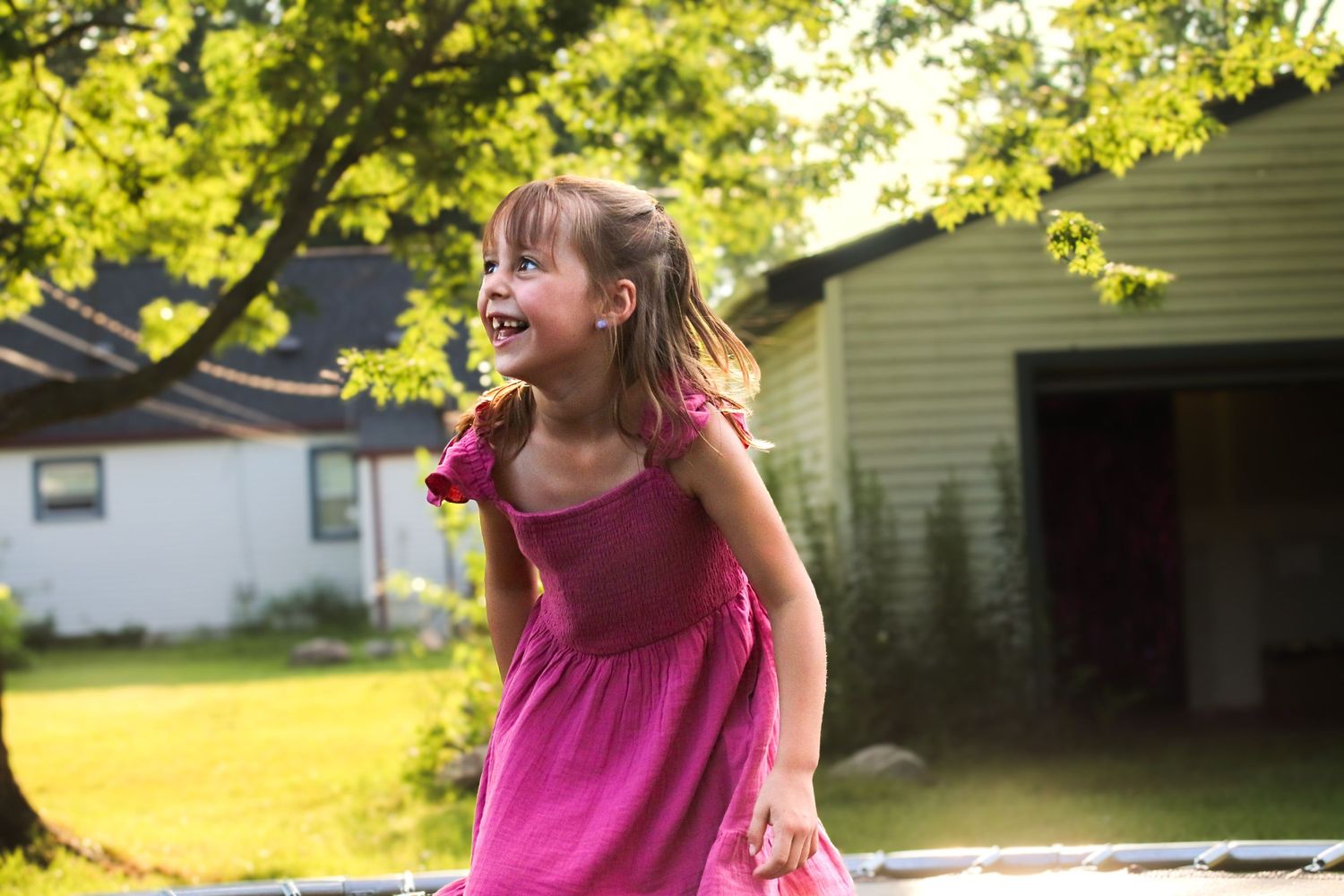Candida child portrait, playing outdoors during a lifestyle, family photography session in Michigan