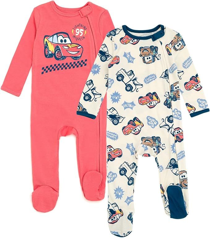 Pink and white baby sleepers with racing car and teddy bear patterns in infant sizes.