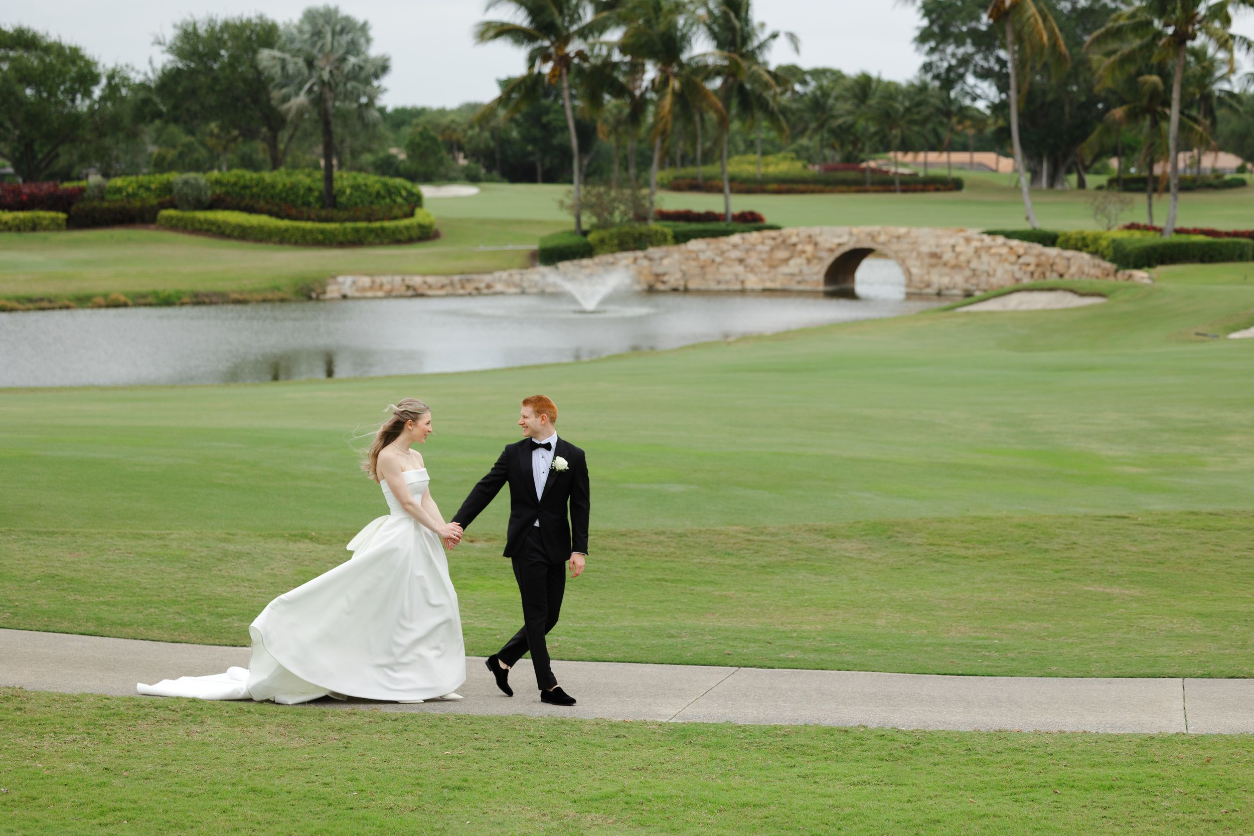 Bride and groom outside at BallenIsles Country Club in Palm Beach, Florida during a wedding photographed by Tom Forrest of Ohio.
