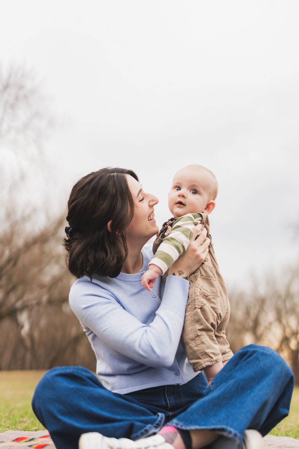 A series of joyful outdoor moments between parent and child on a sunny day in a grassy field.