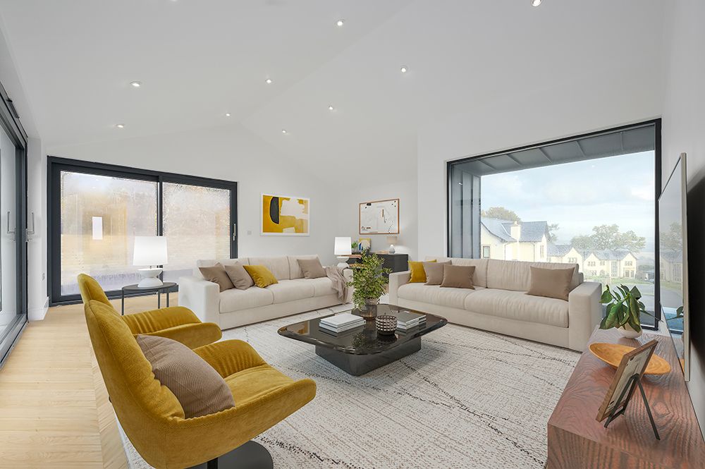 Modern living room interior with gray sofa, yellow accent chair, and large windows providing natural light.