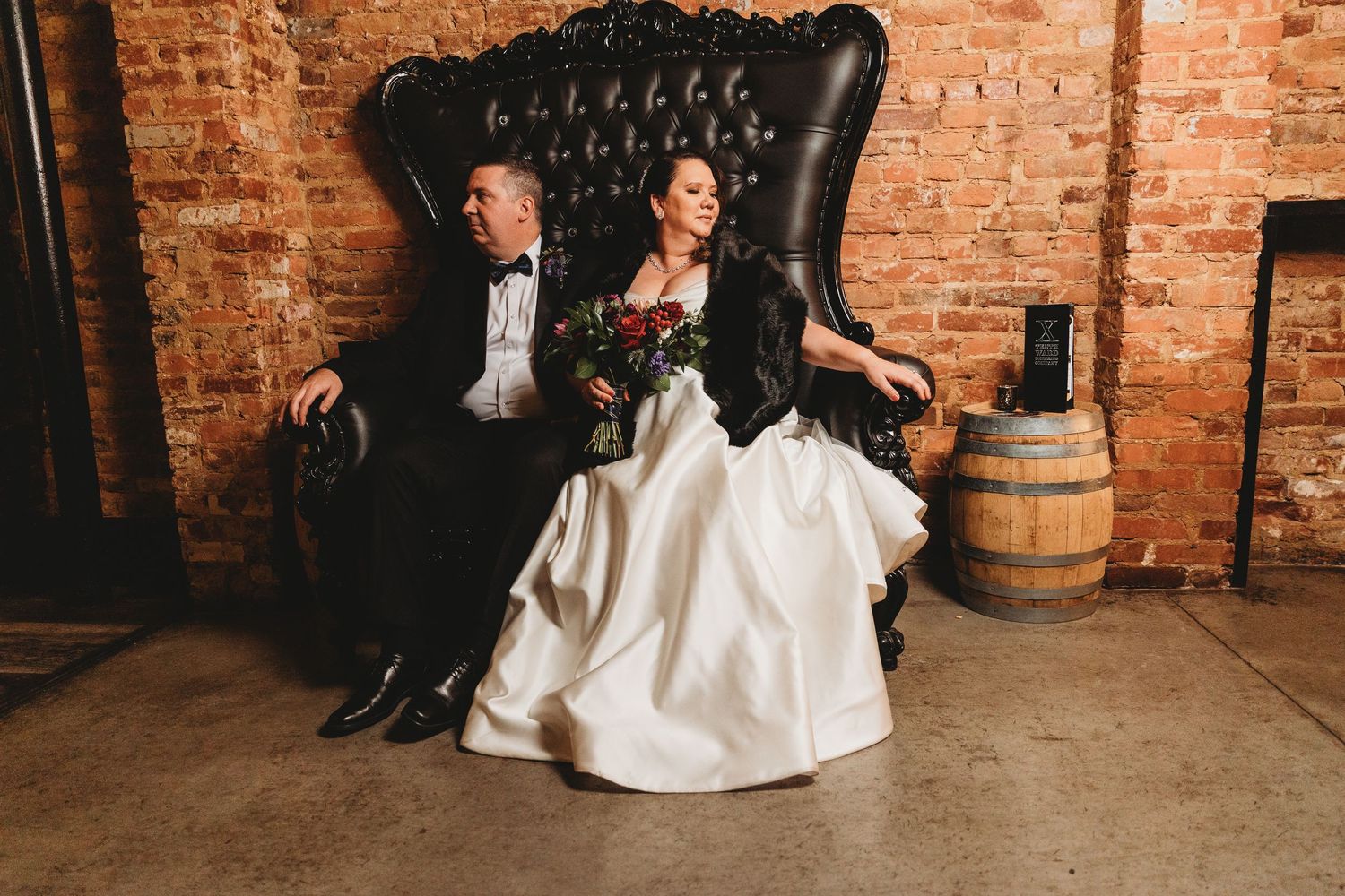 Artistic low-angle shots of wedding attire against rustic brick wall backdrop at Tenth Ward Distilling Company in Frederick, Maryland