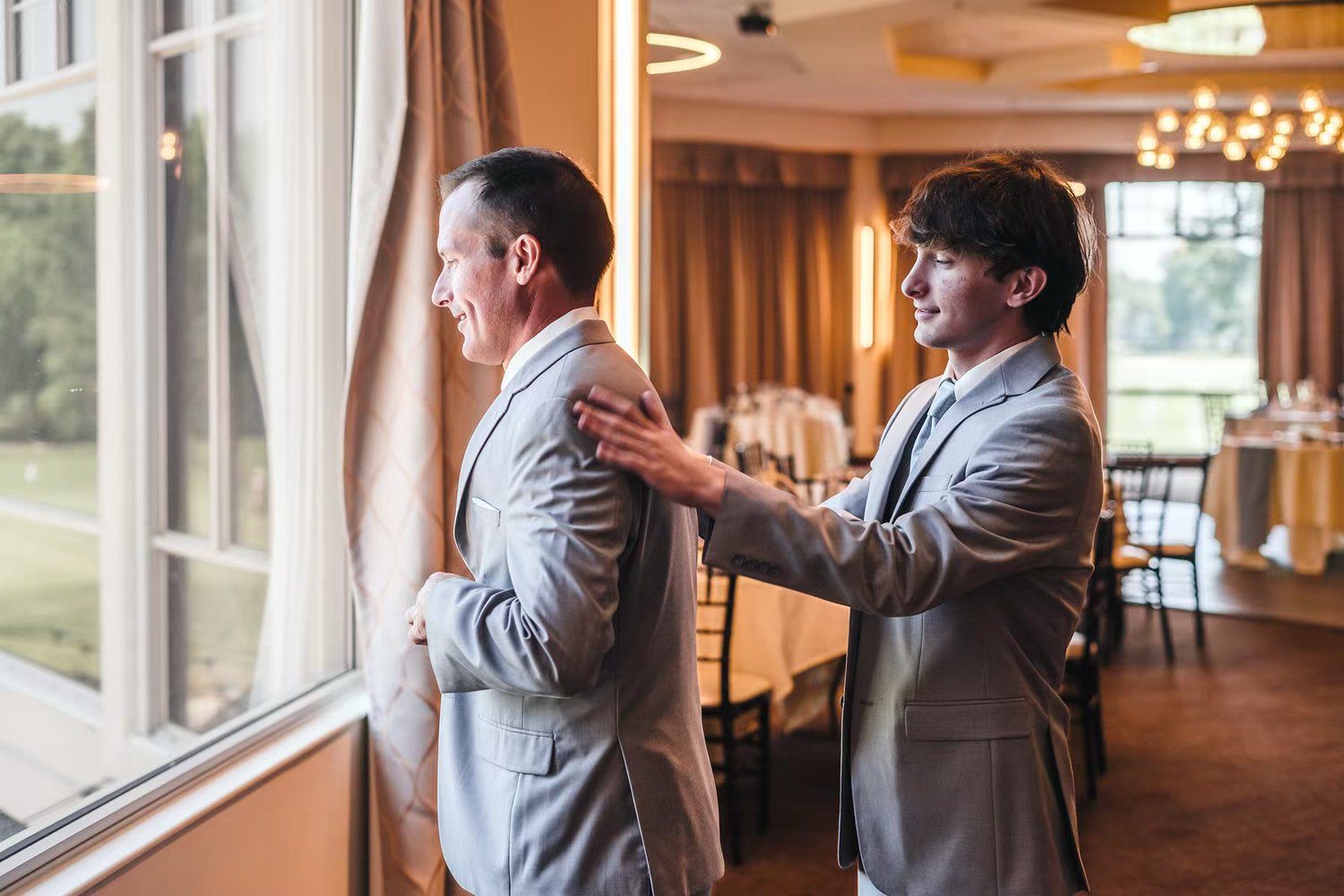 a groom's man posing with the groom in Columbus Ohio wedding venues