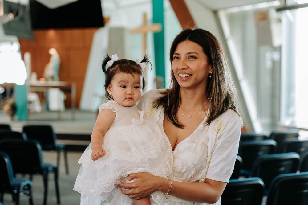 A happy moment shared in a modern church space with colorful geometric wall designs.