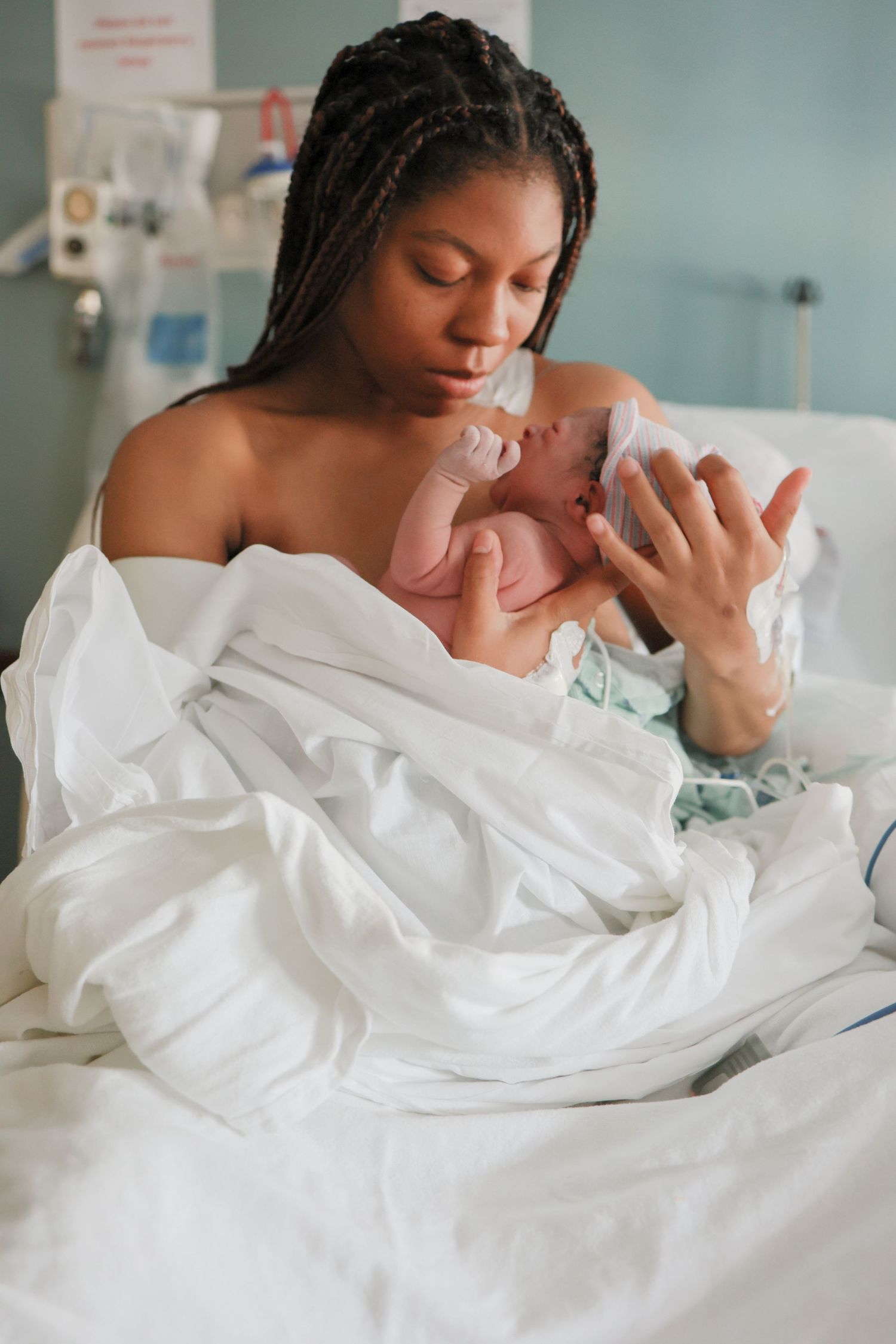 Mom holding newborn in arms