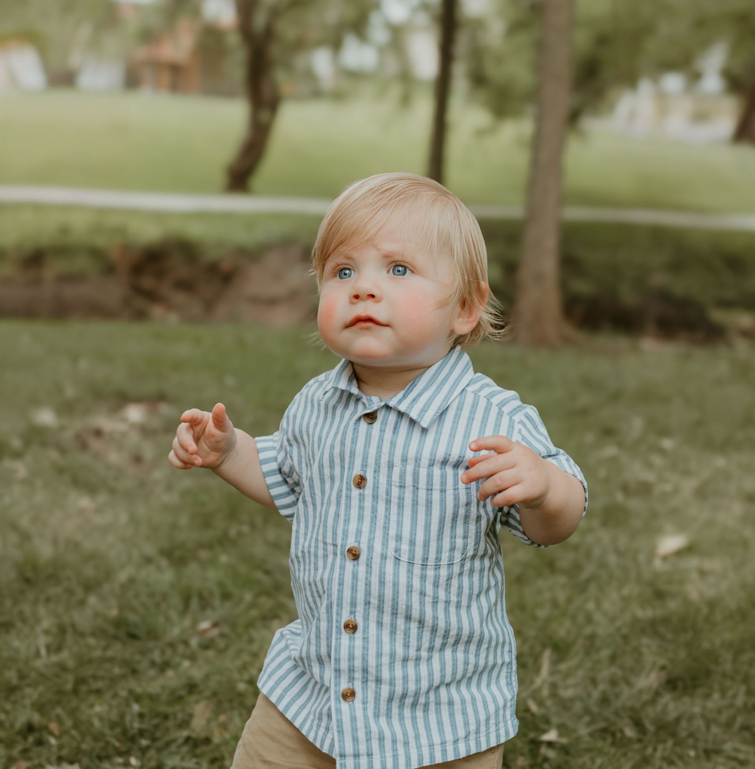 An expressive moment captured during an outdoor photo session in a park. Colorado Springs Photographer.