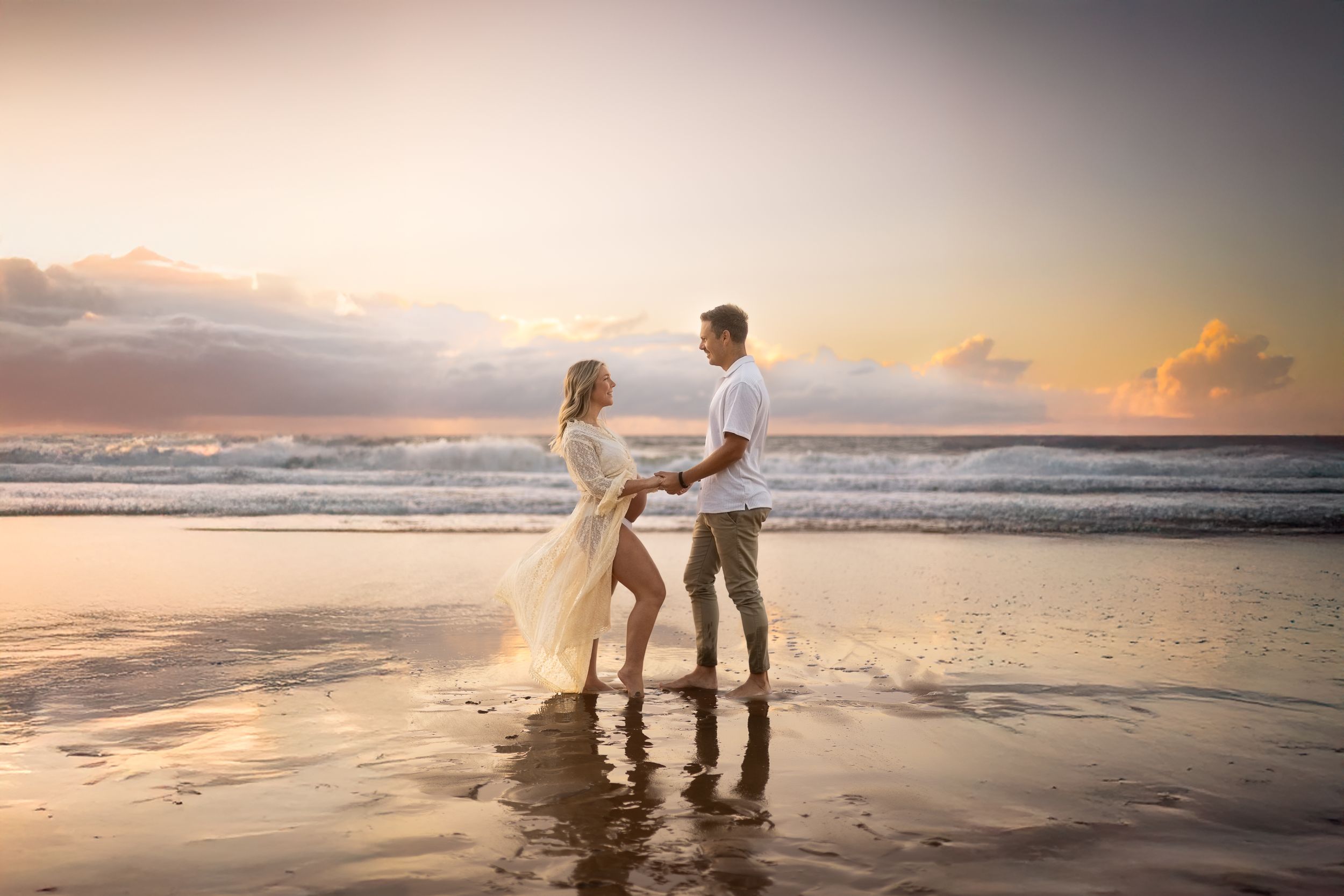 A beautiful newborn portrait taken on the Sunshine Coast with natural light, capturing the joy of new parents