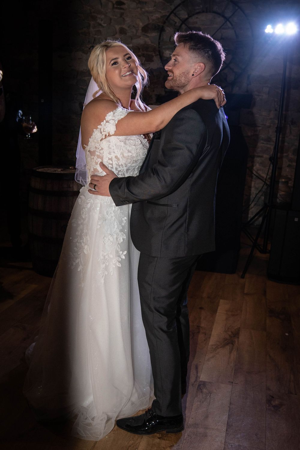 Romantic dance floor moments captured during an intimate wedding reception.