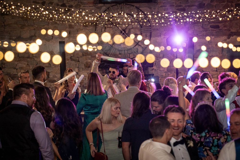 Wedding reception venue decorated with twinkling string lights creating magical atmosphere.