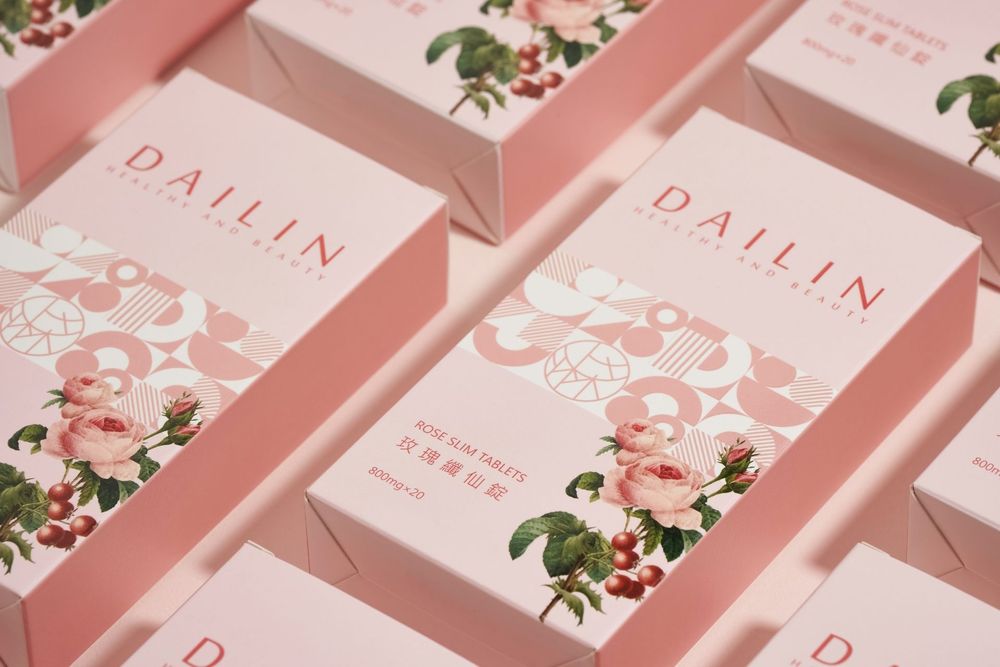 Several pink beauty product boxes with floral designs and 'Dailin' branding arranged in a diagonal pattern.