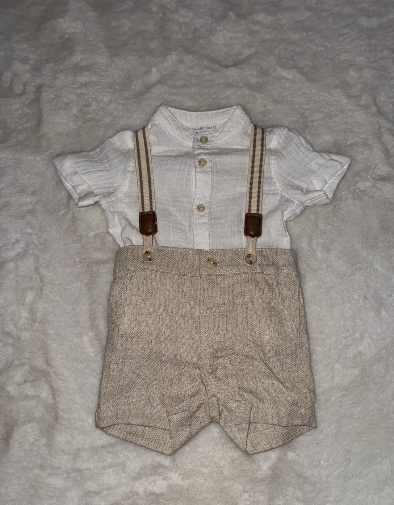 Beige linen baby shorts with white shirt and brown suspenders displayed in multiple views.