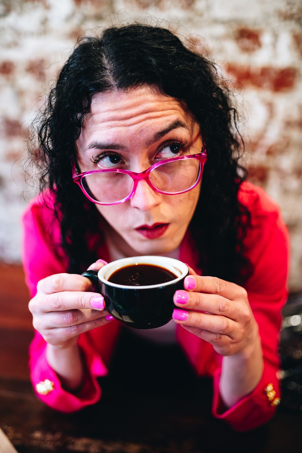 Melbourne branding photo of writer in red blazer and pink glasses with coffee and notebook—perfect for lifestyle and food styling photograph