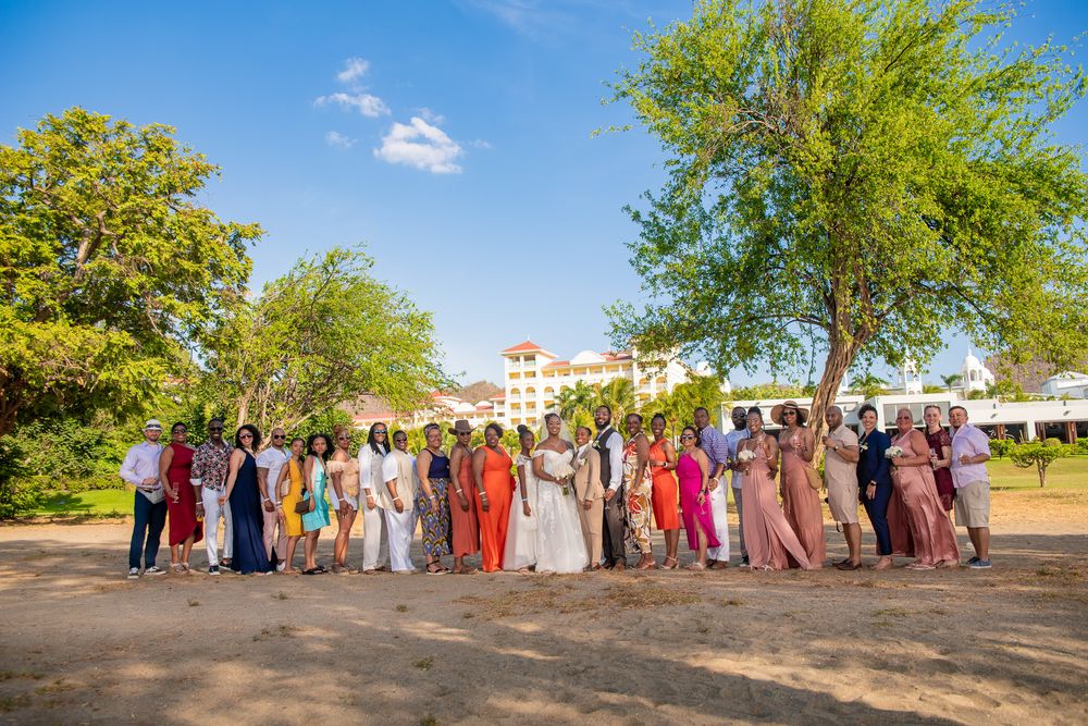 Wedding photoshoot at sunset on the beach in Riu Place, Panoramic group photo
