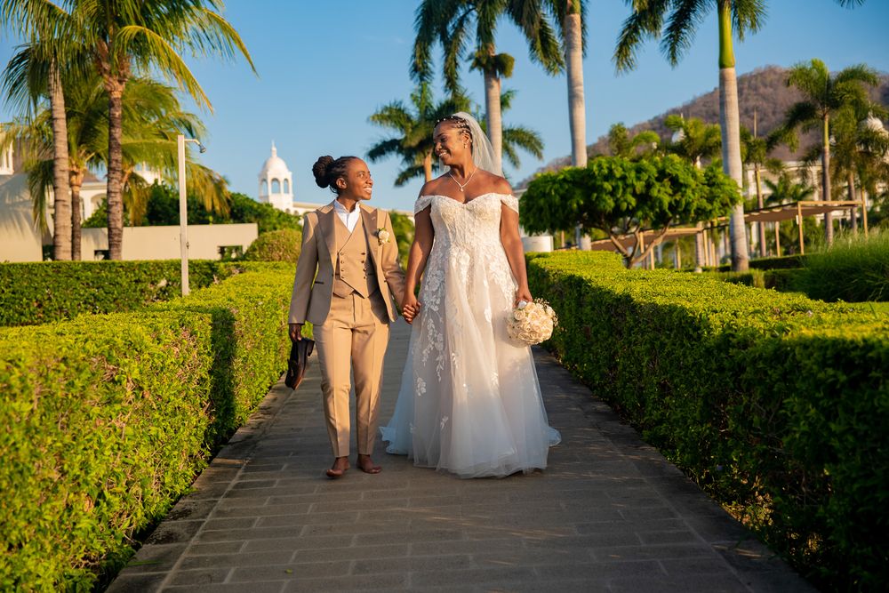 Wedding photoshoot at sunset on the beach in Riu Place, Guanacaste, Costa Rica, in a tropical resort during golden hour.