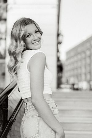 Black and white urban portrait series with architectural elements.