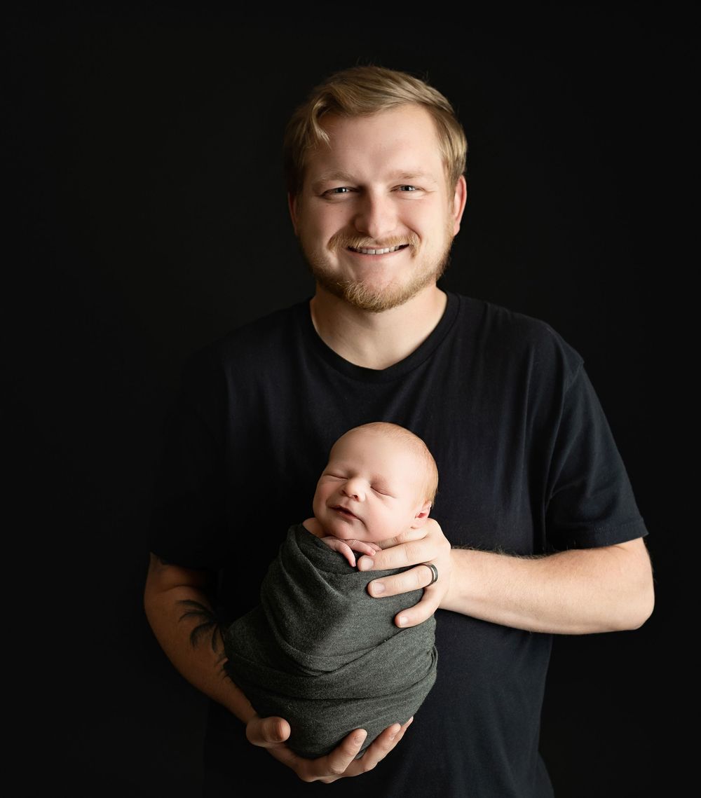 Dad holding his newborn boy. Greenville sc newborn photographer, Easley sc newborn photographer, Upstate newborn photographer, Greenville