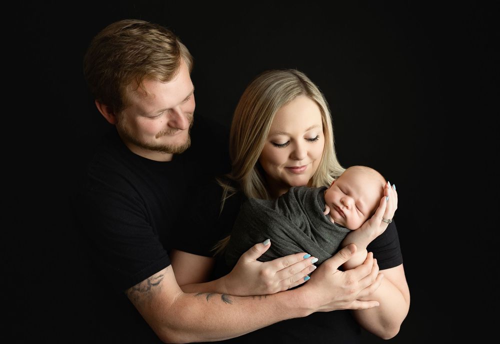 Mom and dad holding baby. Greenville sc newborn photographer, Easley sc newborn photographer, Upstate newborn photographer, Greenville