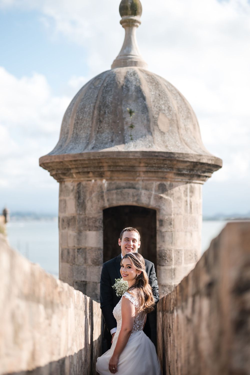 Bride posing inside iconic stone lookout tower in Old San Juan Puerto Rico