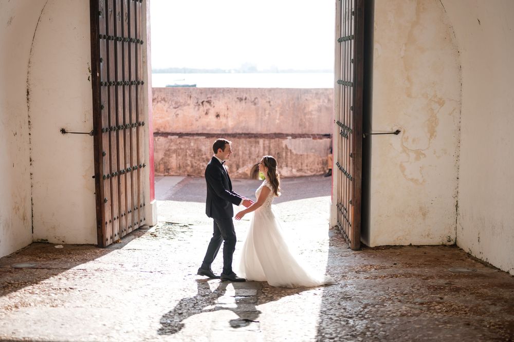 Bride and groom dancing inside historic fort entrance in Old San Juan Puerto Rico