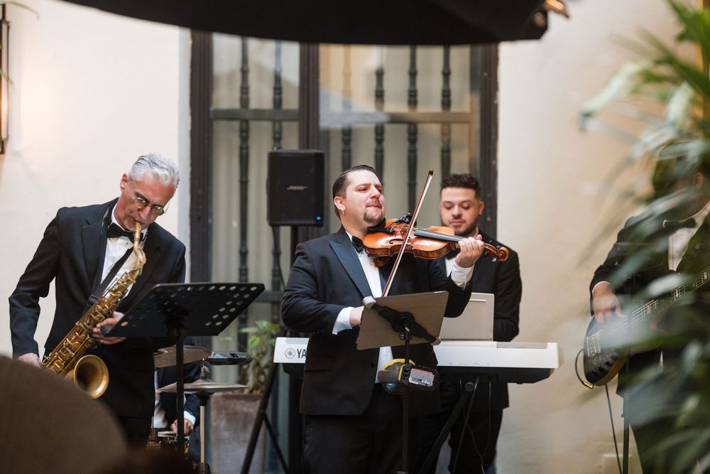 Live musicians performing during wedding cocktail hour at Hotel El Convento