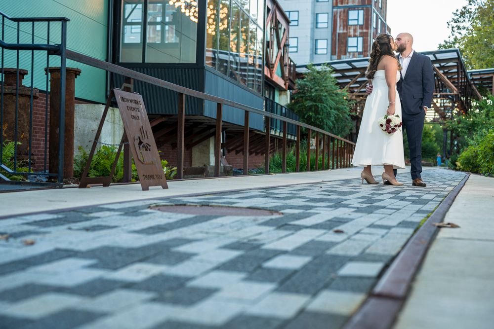 A sequence of photos showing a person in a white dress walking down an urban sidewalk during summer.