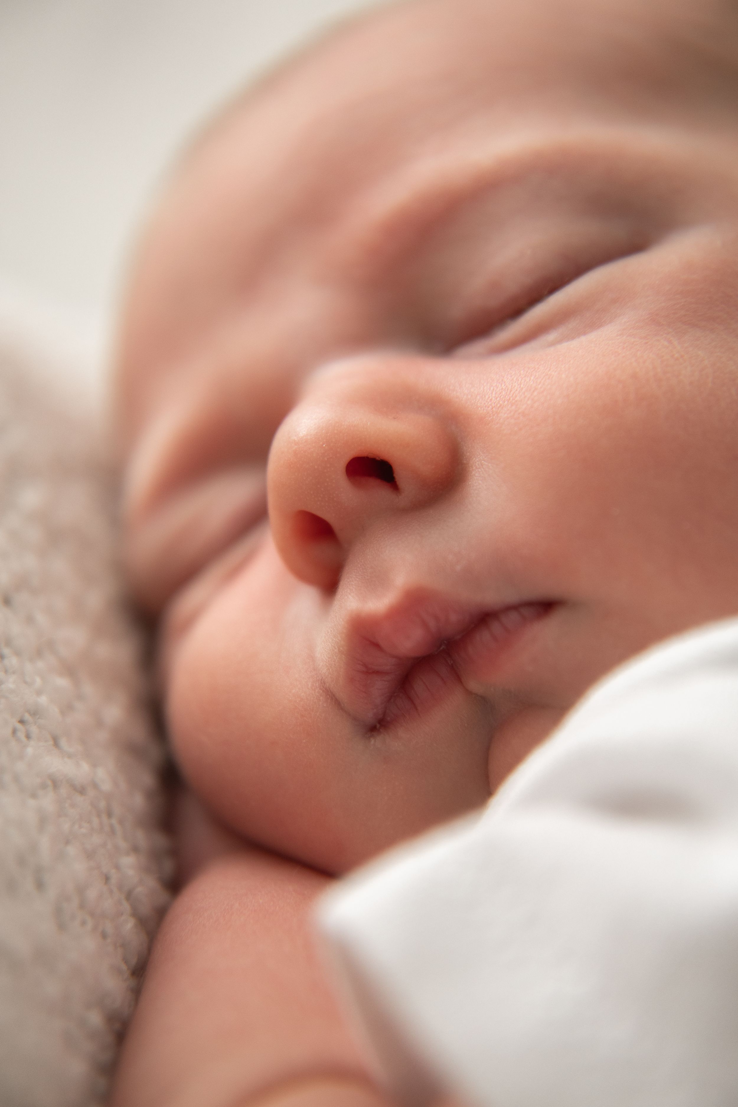 Baby photographer Nottingham newborn session close-up of a peaceful sleeping newborn baby