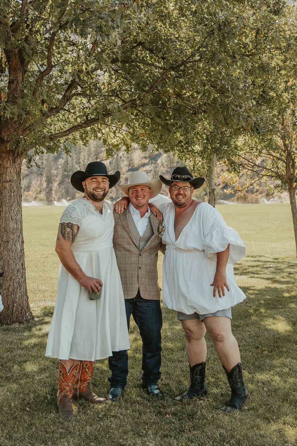 Groom Cody in a plaid jacket and cowboy hat at the American Homestead. Photographed by a Washington wedding photographer. prank first look