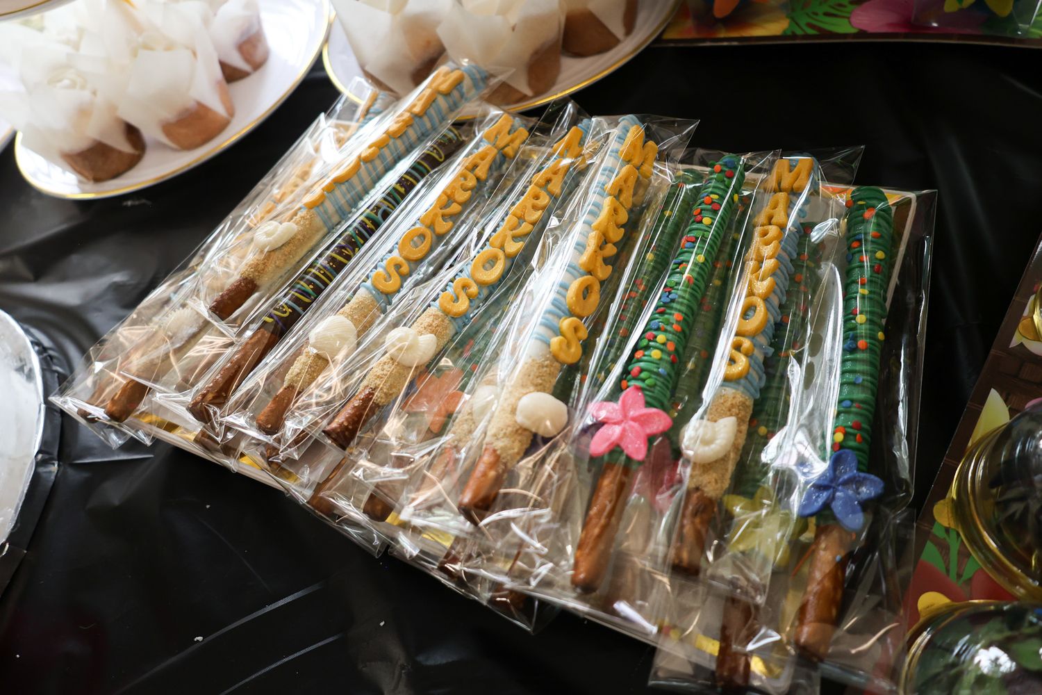 Display of wrapped sandwiches and food items arranged in rows.