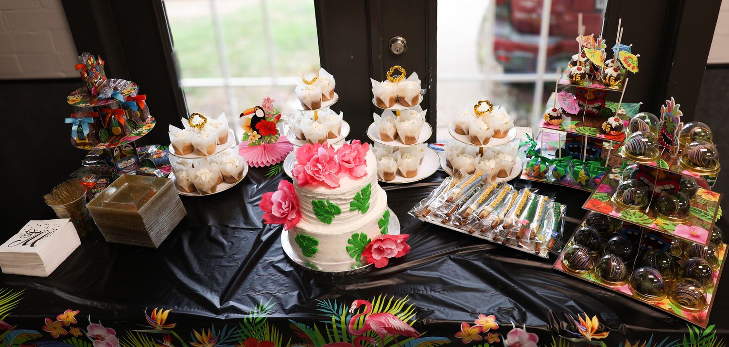 Display of colorful stuffed animals and toys arranged on a table.