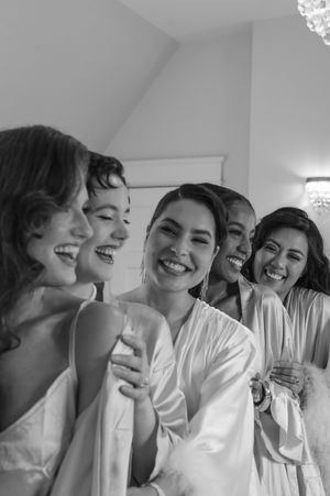 bridal girls laughing at each other