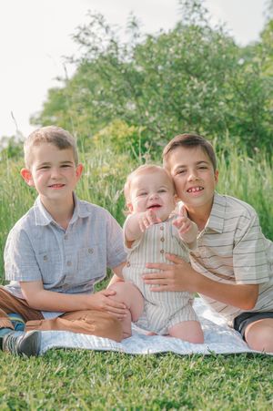 kids sitting on blanket