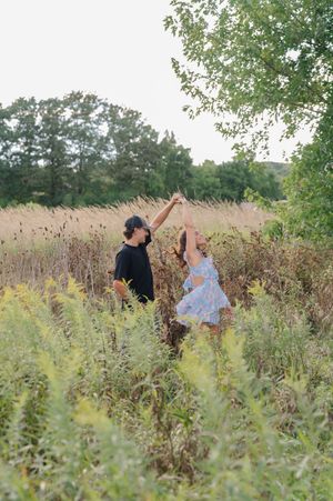 couple spinning in a field