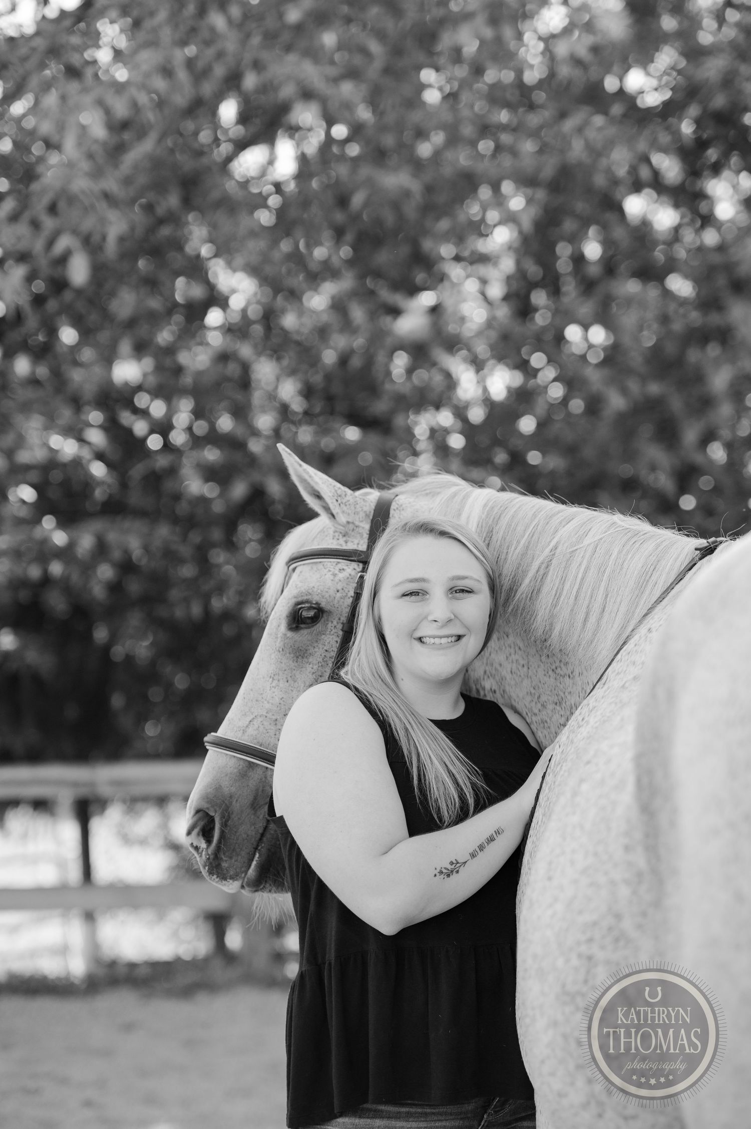 A heartwarming black and white portrait of companionship between horse and owner.