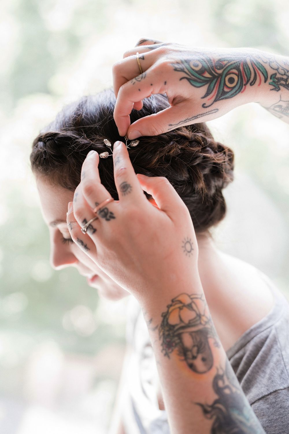 Getting ready photo of bride getting her hair done.