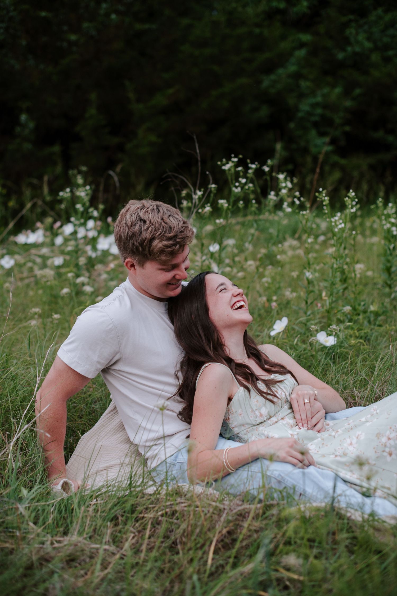 Wichita KS outdoor engagement photos in nature location Andover, couple photos in field with flowers, small elopement wedding photographer