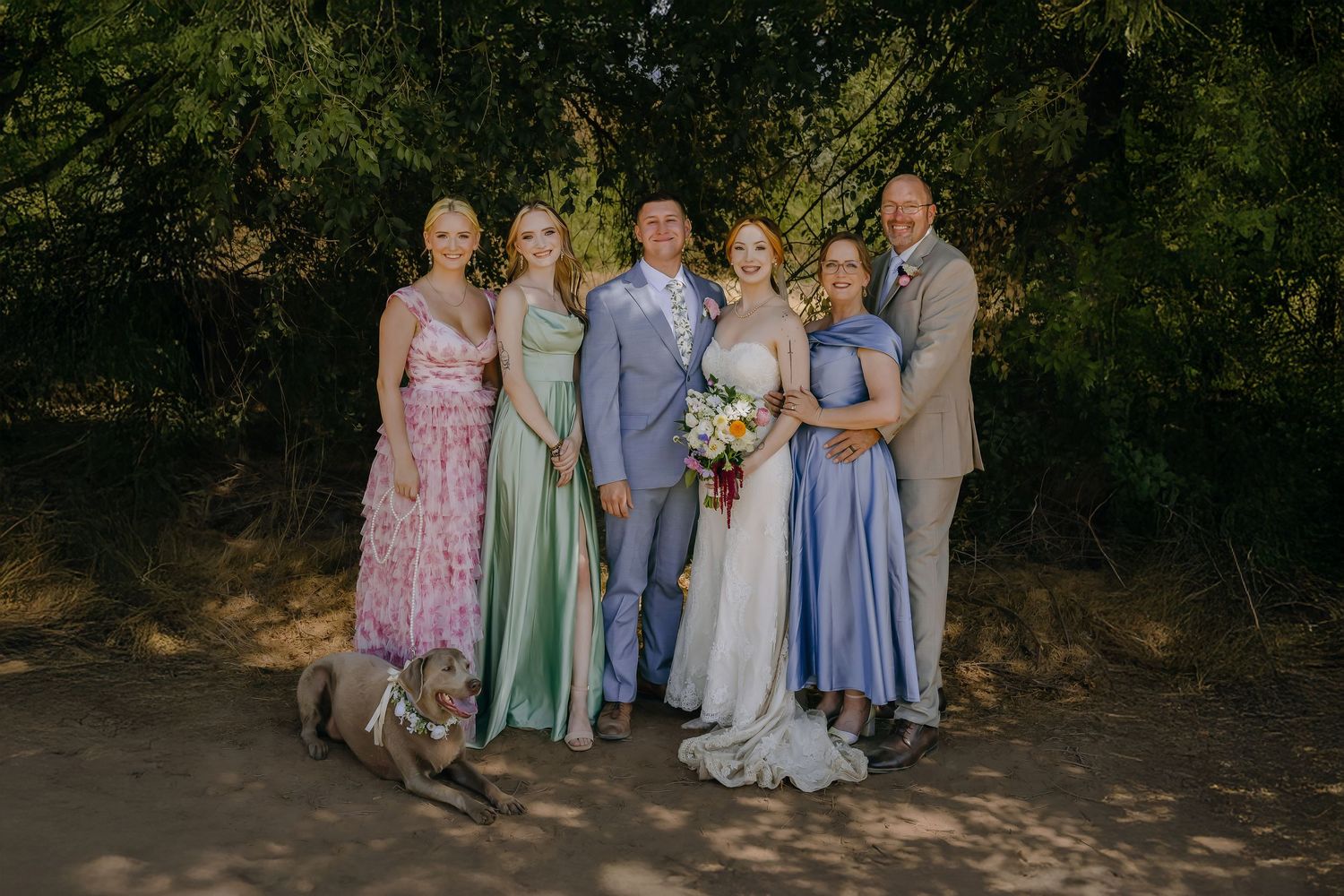 WEdding photo of family of 6 wearing florals and dog