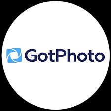 GotPhoto logo featuring a blue camera icon and bold text on a white circular background.