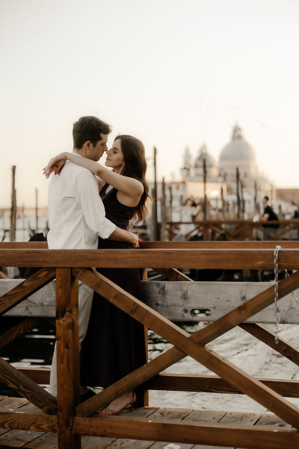 A sweet kiss on the forehead during a luxury couple session in San Marco, Venice.