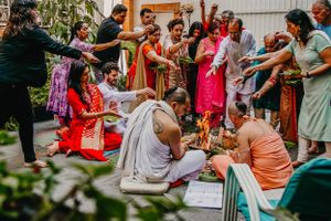 Guests participating in traditional Indian wedding rituals and celebrations.
