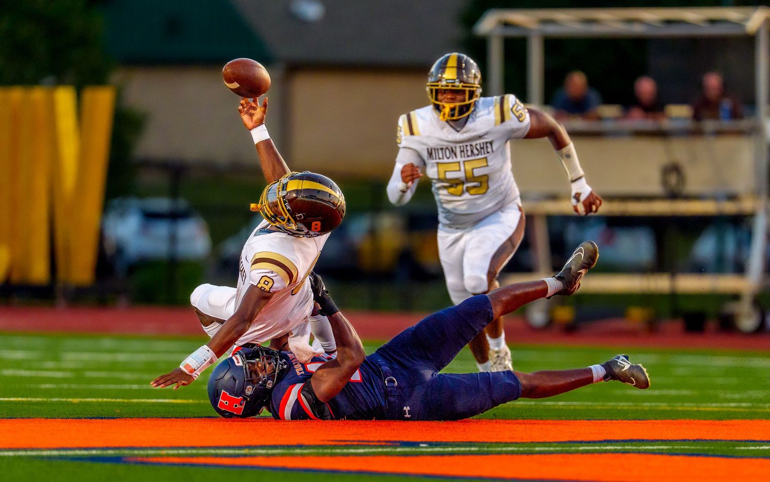 High school football player tackled game day action photography, Central PA, by Deanna Fox, SportsFox Photography, Hershey PA