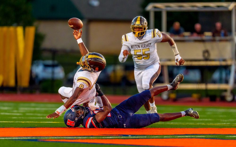 High school football player tackled game day action photography, Central PA, by Deanna Fox, SportsFox Photography, Hershey PA