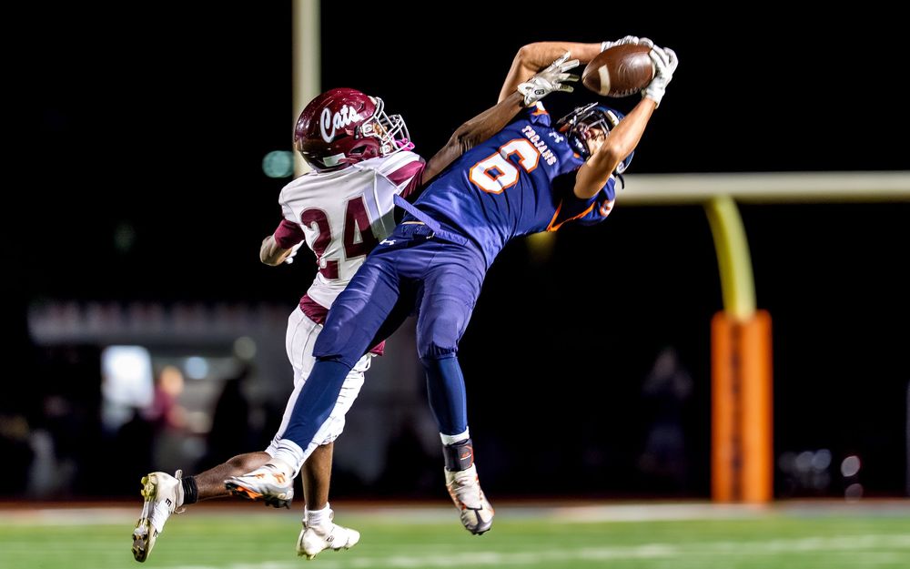 High school football receiver leaping catch game day action photography, Central PA, by Deanna Fox, SportsFox Photography, Hershey PA
