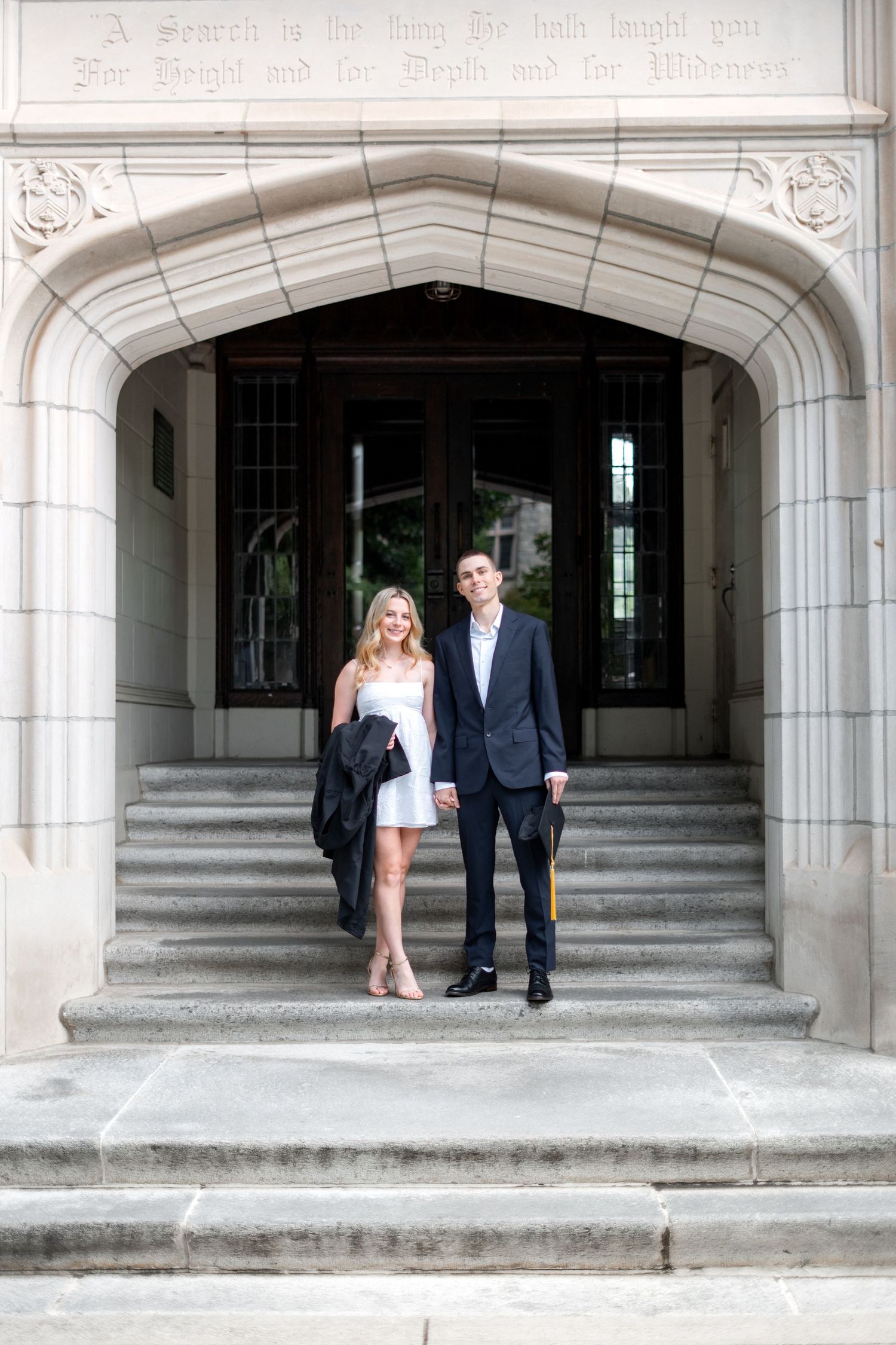 Smiling graduate poses for the best Atlanta grad photos at Oglethorpe University with portraits by Pierre The Pear Photography