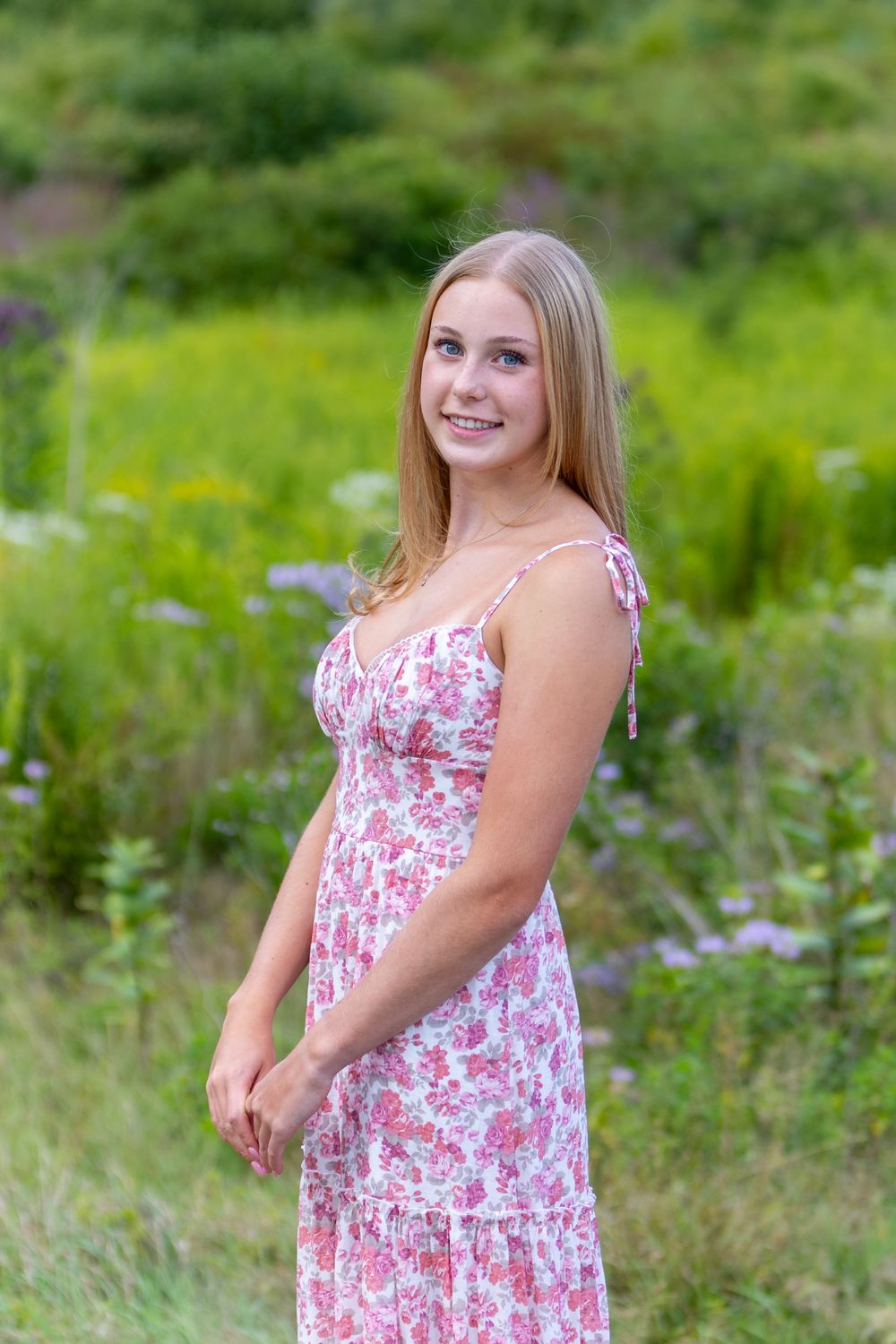 High school senior from Lincoln Sudbury poses for yearbook photos in a wildflower field.  Serving Wayland High School and Weston High MA .