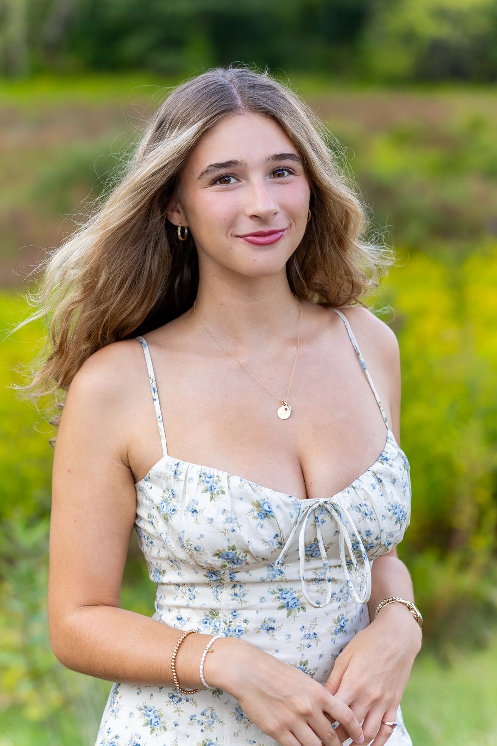 High school senior from Lincoln Sudbury poses for yearbook photos in a wildflower field.  Serving Wayland High School and Concord Carlisle .