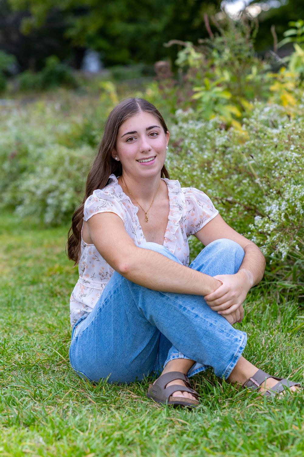Senior portraits for Nashoba High School poses for yearbook photos in a wildflower field.  Serving Weston High School & Wayland. in Concord