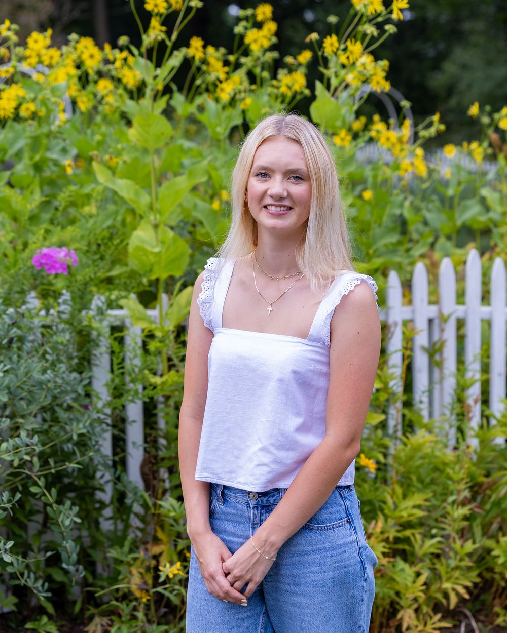High school senior from Lincoln Sudbury poses for yearbook photos in a flower garden.  Serving Wayland High School and Concord Carlisle .