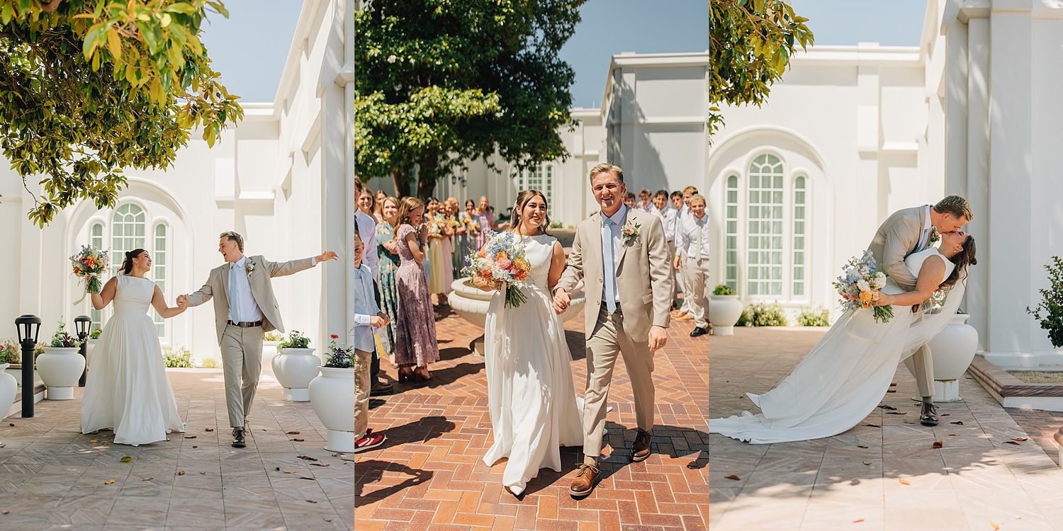 Bride and groom celebrate outside white chapel with wedding party lining brick pathway on sunny day.