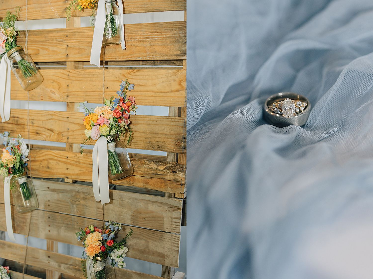Rustic wooden pallet wedding backdrop with colorful floral arrangements in glass jars beside wedding rings on soft blue fabric.