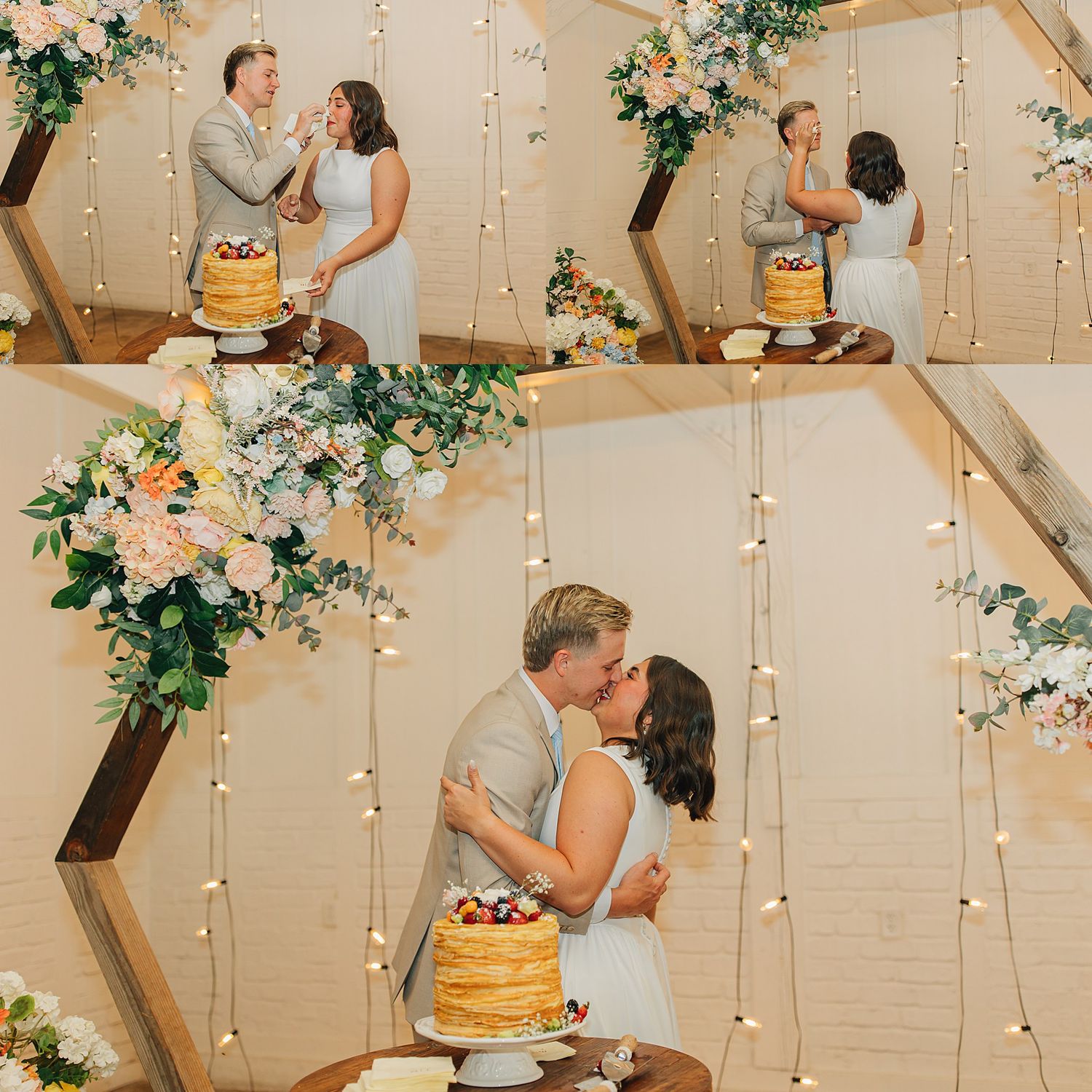 Bride and groom cutting and sharing wedding cake in front of a wooden hexagon arch with fairy lights and floral arrangements.
